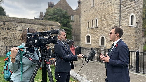 Tom Gordon with the press on College Green