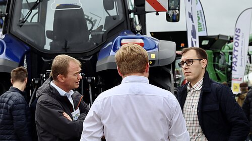 Tom Gordon and Tim Farron in front of a tractor at the Great Yorkshire Show