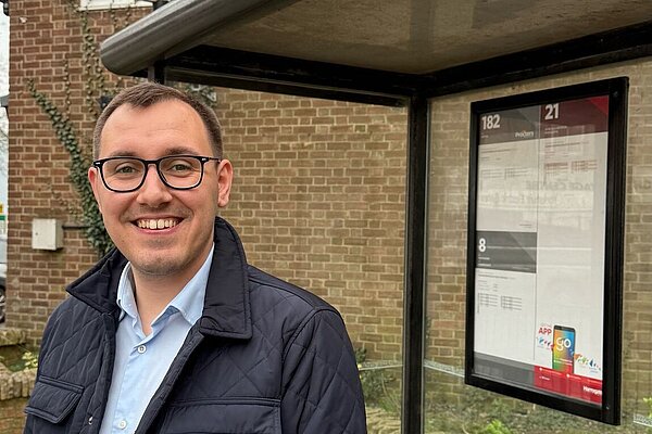 Tom Gordon stood at a bus stop 