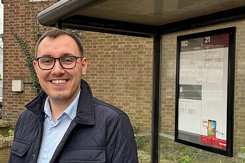 Tom Gordon stood at a bus stop