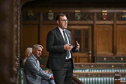 Tom Gordon stood speaking in the House of Commons