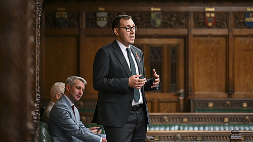 Tom Gordon stood speaking in the House of Commons