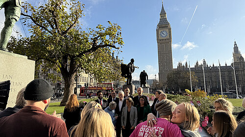 Tom Gordon with Kim Leadbeater and other MPs with Dignity in Dying activists on Parliament Green by the Houses of Parliament