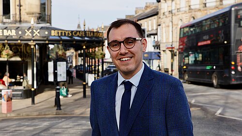 Tom Gordon MP stood in central Harrogate outside Bettys