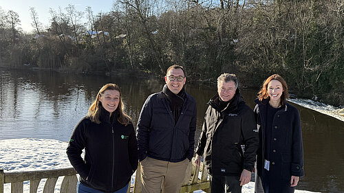 Tom Gordon with Councillor Hannah Gostlow and two employees of the Environment Agency in front of the River Nidd at Knaresborough Lido