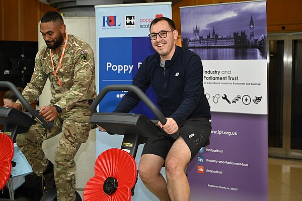 Tom Gordon on a exercise bike with a poppy on the front